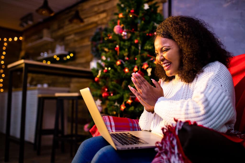 Woman happily talking to someone over a video call