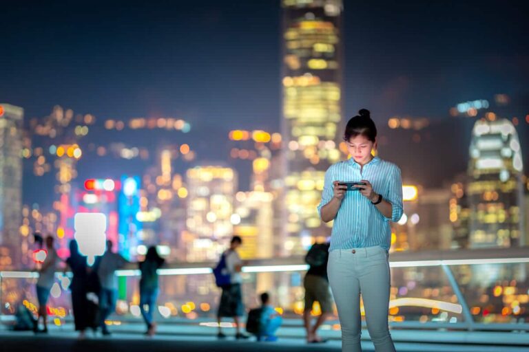 What is Alipay: woman at a rooftop checking her phone