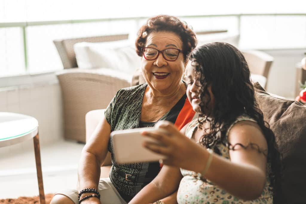 Grandma and granddaughter smiling