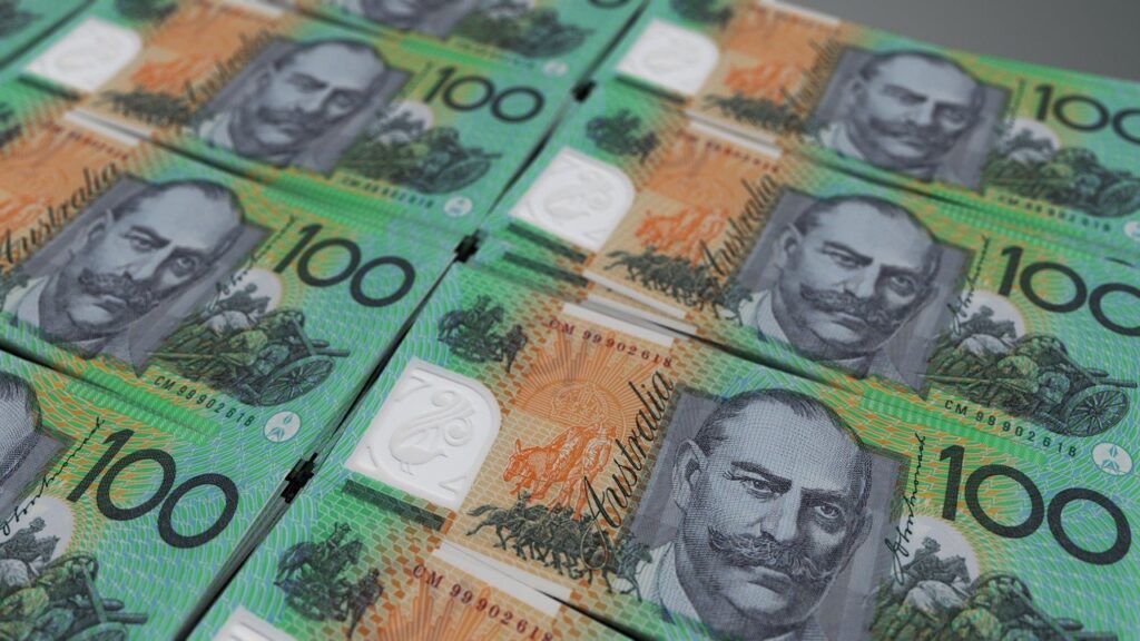 australian dollar notes stacked on top of each other