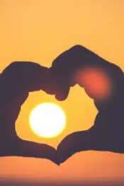 What countries celebrate Valentine's Day: couple making a heart shape using their hands