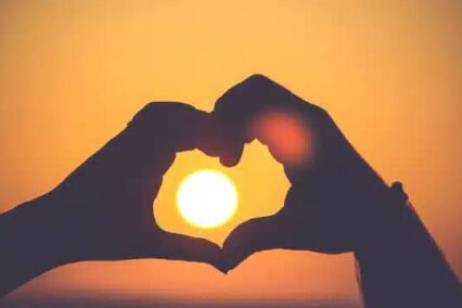 What countries celebrate Valentine's Day: couple making a heart shape using their hands