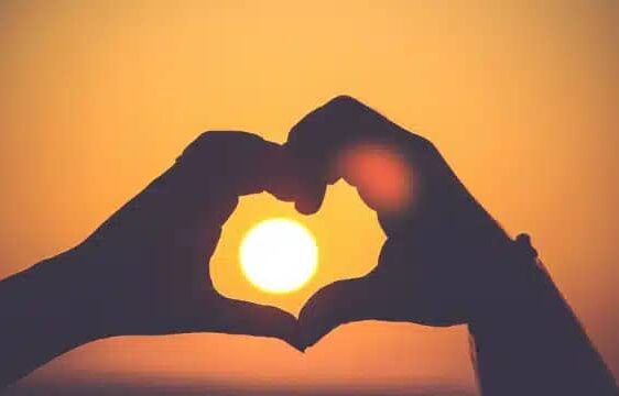 What countries celebrate Valentine's Day: couple making a heart shape using their hands