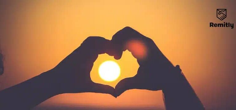 What countries celebrate Valentine's Day: couple making a heart shape using their hands