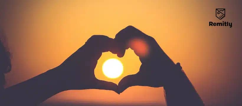 What countries celebrate Valentine's Day: couple making a heart shape using their hands