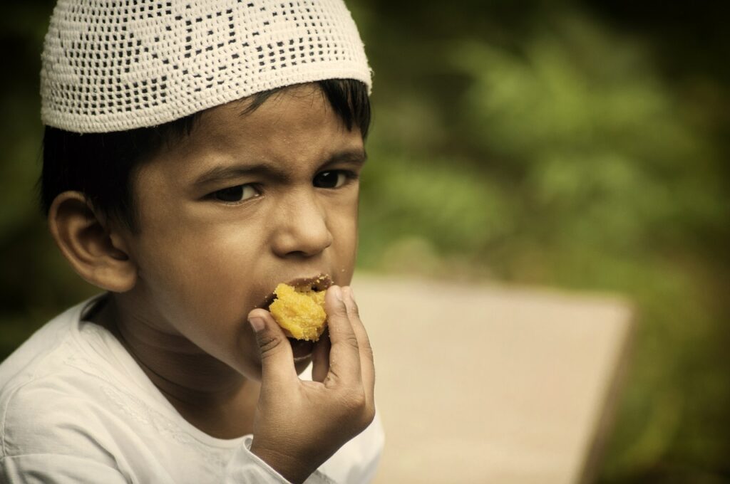 Little boy eating cake