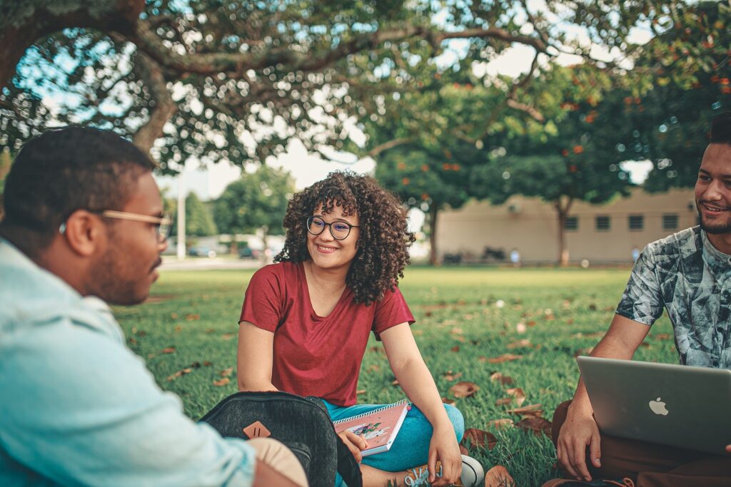 international students sitting in a circle discussing how to get an internship on an F-1 visa