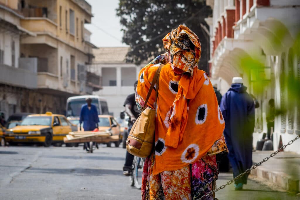 Back view of a person walking on a street