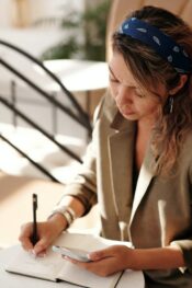 How to endorse a check: woman writing in her notebook