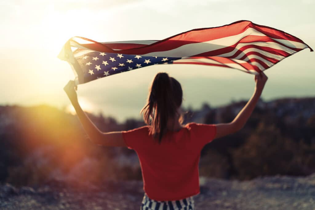 Woman holding the US flag