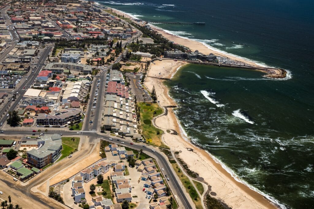 an aerial view of a city and ocean