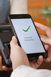 What is a digital wallet: customer using a phone to pay bills