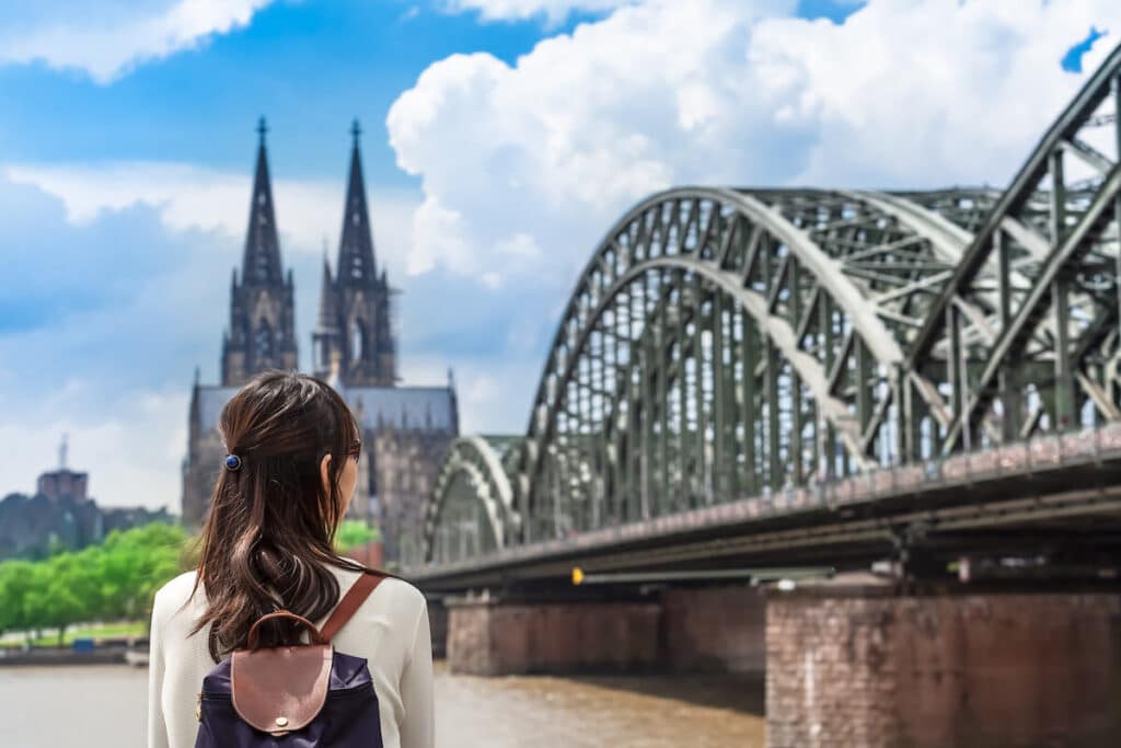 Woman looking at the Hohenzollern Bridge