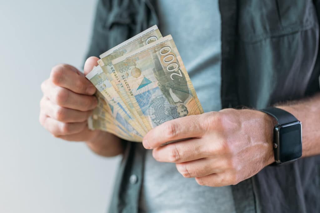 Person holding Serbian dinars