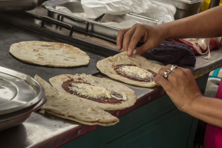 3 honduran baleadas being hand made