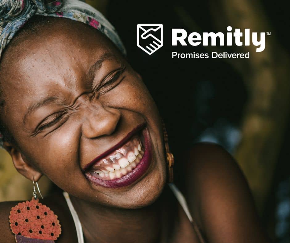 African woman laughing with Remitly logo
