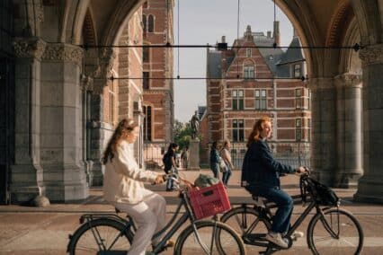 Women on bicycles on the streets of Amsterdam, the Netherlands