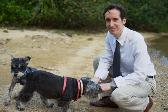 Photo of Dr. Matthew Murdoch with two dogs