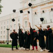 Students celebrating graduation on a scool campus