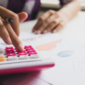 Business woman calculate about cost and doing finance at office, Finance managers task.