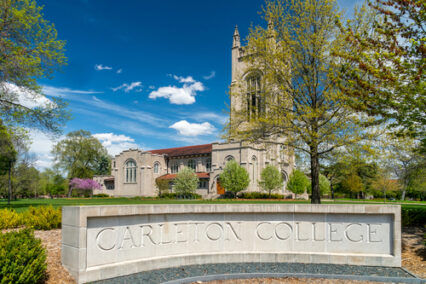 Entrance sign and Skinner Memorial Chapel on the campus of Carleton College.