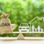 Loan bags, family in a house on balance scale
