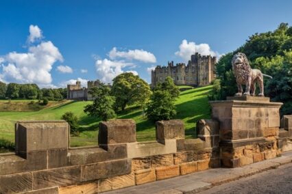 The Lion Bridge over the River Aln in Northumberland, with Alnwick Castle in the background.