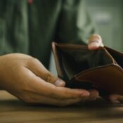 Empty wallet in the hands of a man