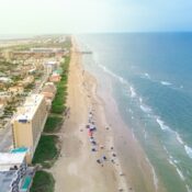 Exquisite barrier South Padre Island tropical beach with condos, hotels, resorts boardwalk and jetty access to sandy shoreline