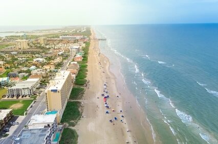 Exquisite barrier South Padre Island tropical beach with condos, hotels, resorts boardwalk and jetty access to sandy shoreline