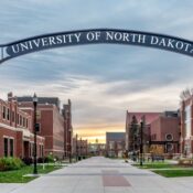 Entrance gate at dusk at the University of North Dakota.