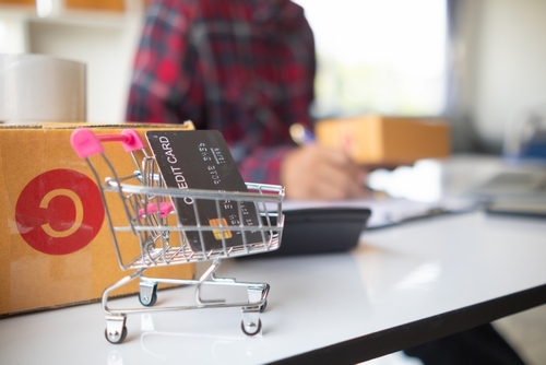 Credit card in small shopping car is a credit card that is available for online shopping for the convenience of paying for products through an online application.