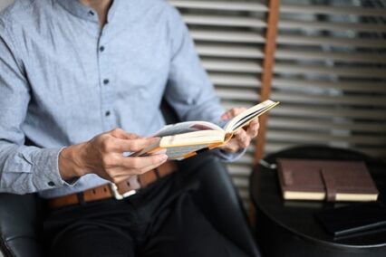 Close up of businessman reading a book