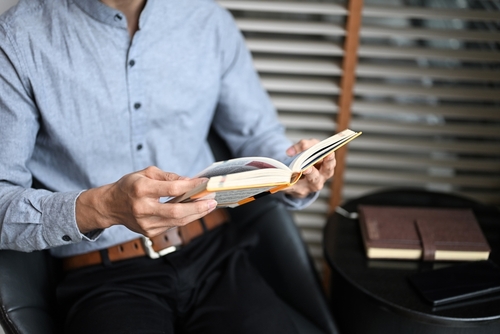 Close up of businessman reading a book
