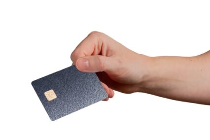 Hand showing a dark metallic credit card