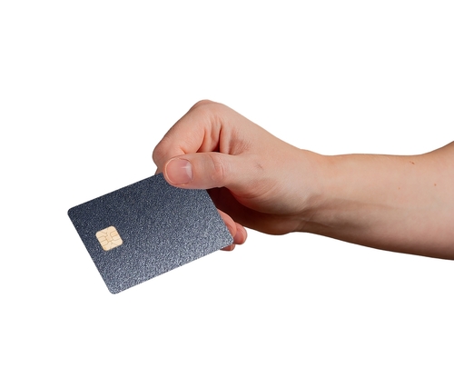 Hand showing a dark metallic credit card