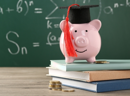 Piggy bank with graduate hat
