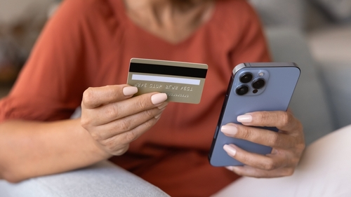 A person making financial transactions on internet application on a smartphone