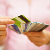 A person choosing a credit card from many