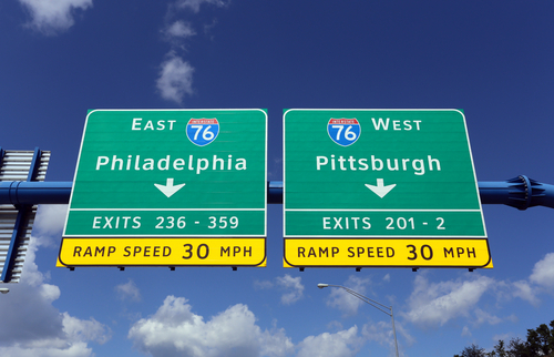 An interstate sign in Pennsylvania gives drivers the choice of driving to Philadelphia or Pittsburgh.