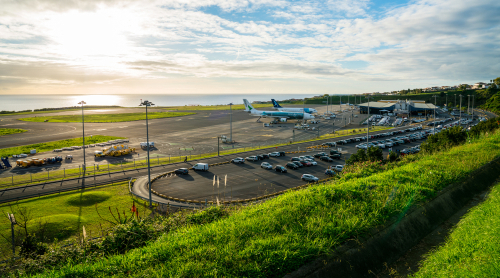 San Miguel, Azores. Aerial view on the airport with few planes parked by the terminal. The airport is located by the Atlantic ocean.