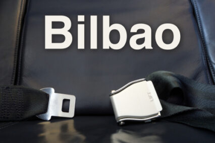 Airplane comfortable leather seat awaiting passenger for voyage.