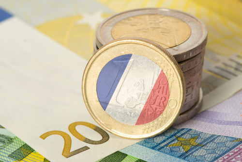 Euro bills and coins and flag of France