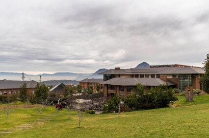 Universidad de los andes in santiago, chile at a cloudy day nice architecture photography mountains and skyline in the background