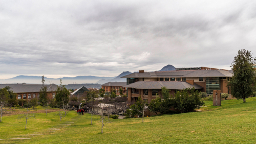 Universidad de los andes in santiago, chile at a cloudy day nice architecture photography mountains and skyline in the background