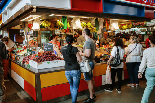 People buying fresh fruits at Atarazanas Market in Malaga, Andalusia