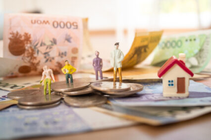 Korean banknotes with models in work clothes and Korean won coins