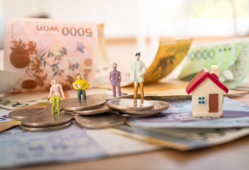 Korean banknotes with models in work clothes and Korean won coins