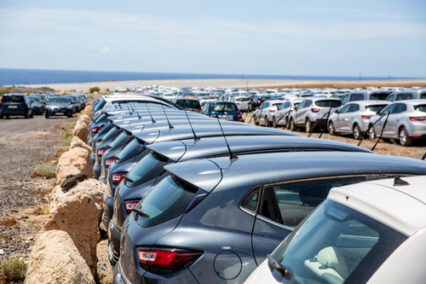 Rental cars parked outside an airport