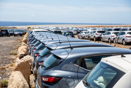 Rental cars parked outside an airport